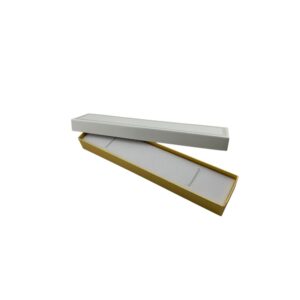 Two-piece paperboard box with two elastic straps to hold a bracelet. The lid is white leatherette decorated with a gold border. The bottom of the box is wrapped in gold foil with a white velvet bracelet insert.